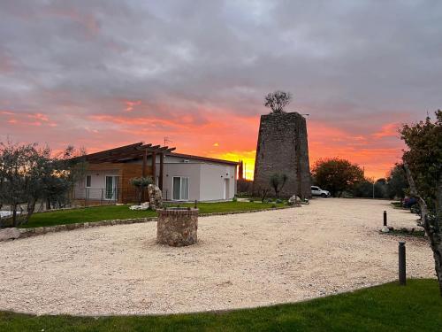 a house and a building with a windmill at Torre Menerva Viterbo piscina & SPA privata in Bullicame