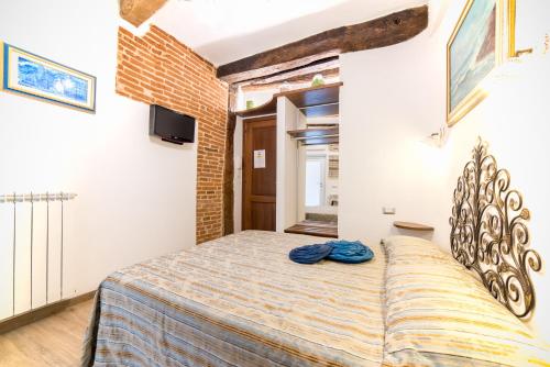 a bedroom with a large bed in a room at The Vernazza Main Plaza - Rooms & Suites in Vernazza