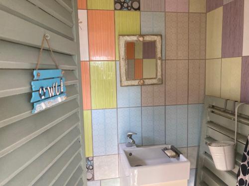 a bathroom with a sink and a toilet at mobile house on a herbs farm in Ajdovščina