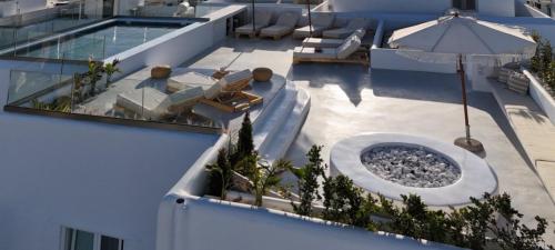 an aerial view of a building with a swimming pool at Naxian Spirit Inn in Naxos Chora