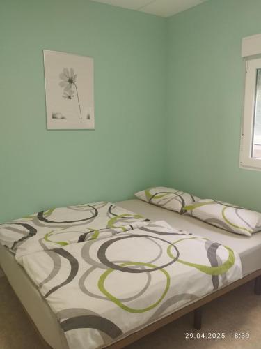 a bed in a room with a blanket on it at Apartment Mariposa Azul in Icod de los Vinos