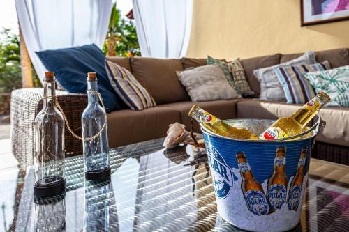 a bucket of beer bottles on a table in a living room at Villa Casa Presioso with great view and private pool in Kralendijk