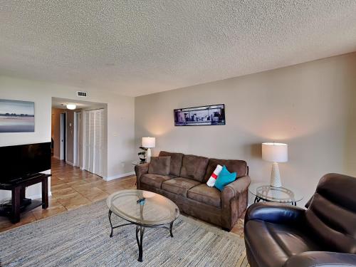 a living room with a couch and a table at Santa Rosa Dunes #1022 in Pensacola Beach