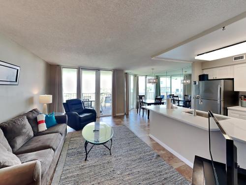 a living room with a couch and a table at Santa Rosa Dunes #1022 in Pensacola Beach