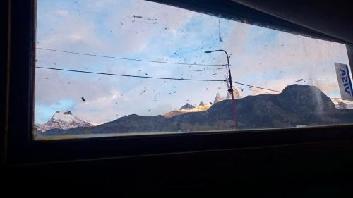 a view of a mountain from a train window at Cabaña el ojo de Horus el chalten santa cruz in El Chalten