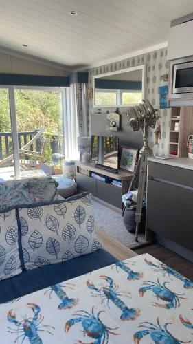 a room with a bed and a desk in a room at Serenity in Saint Erth