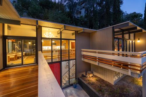 a house with a porch and a deck at New Listing Architectural Villa by Colby & Conrad in Los Angeles