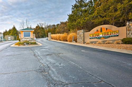 a road with a sign and a sign for a town hicks sign at On-Site Lake of the Ozarks Access Camdenton Condo in Camdenton