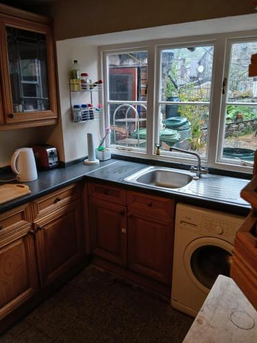 a kitchen with a sink and a window at Forden House in Dolgellau