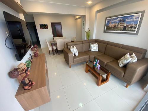an overhead view of a living room with a couch and a table at Hotel La Libertad - Ayacucho in Ayacucho
