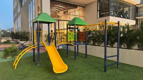 a playground in a building with a yellow slide at Apartamento Frente al Mar D Lujo 901- Santa Marta in Playa Bello Horizonte