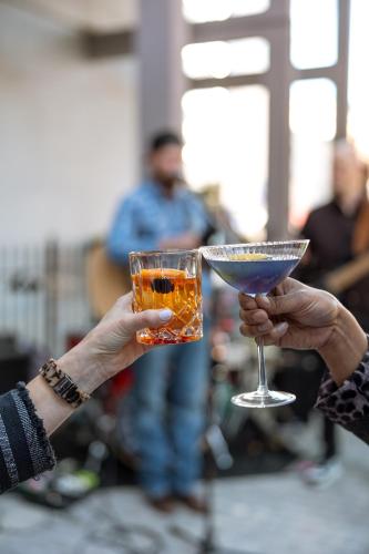 two people holding a drink in their hands at Hilton Knoxville in Knoxville
