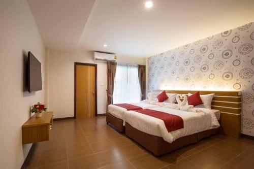 Katil atau katil-katil dalam bilik di Tee Pak Dee Resident Phuket
