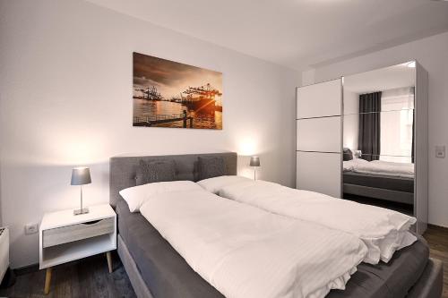 Postel nebo postele na pokoji v ubytování LIV Design Apartments Ettlingen-Zentrum