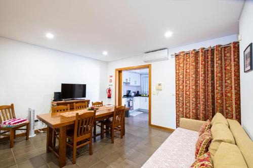 a living room with a table and a dining room at Sailorman and Friends in Ponta Delgada