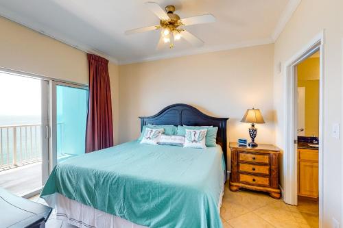a bedroom with a bed and a ceiling fan at Crystal Tower 2006 in Gulf Shores