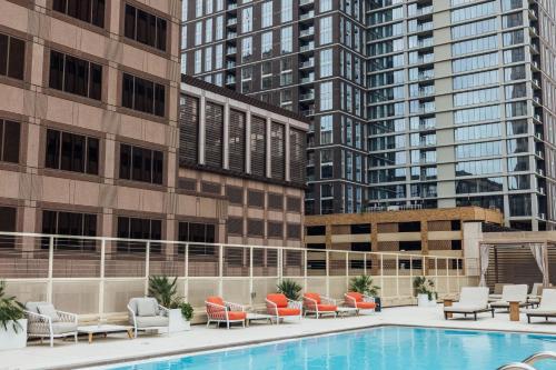 a hotel swimming pool with chairs and a building at InterContinental San Antonio Riverwalk by IHG in San Antonio