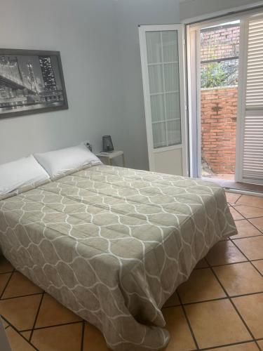 Ένα ή περισσότερα κρεβάτια σε δωμάτιο στο Apartamento turísticos ilusiones 1