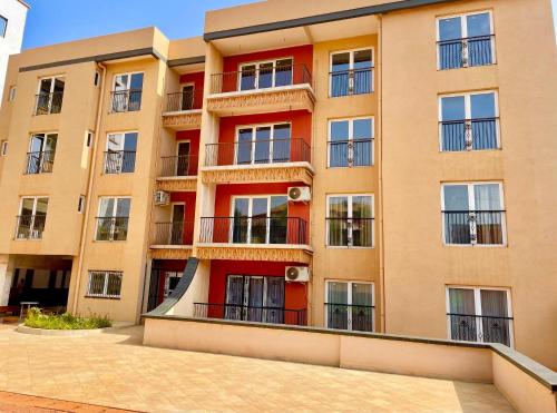 a building with balconies on the side of it at MAISON SUISSE Emana Yaoundé, Appartements meublés de luxe in Yaoundé