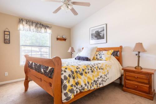 a bedroom with a bed and a ceiling fan at Mariposa Ridge Retreat in Mariposa
