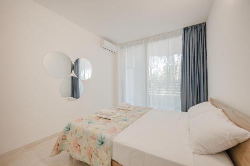 Postel nebo postele na pokoji v ubytování Vacanze Residence Mimose