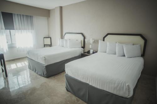 Days Inn by Wyndham Tuxtepecにあるベッド