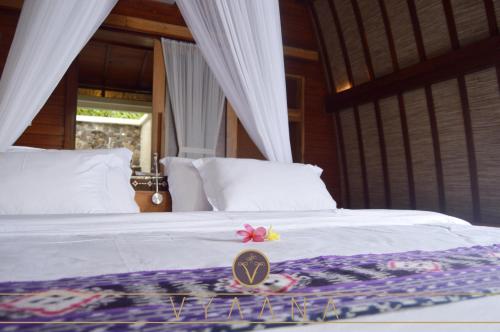 Llit o llits en una habitació de Vyaana Resort Gili Air