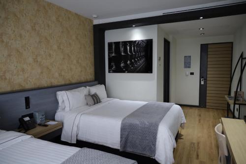 Кровать или кровати в номере Hotel Catedral