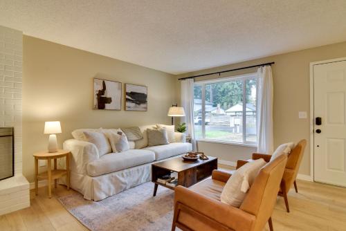 a living room with a couch and a window at Lovely Vancouver Retreat with Home Gym! in Vancouver