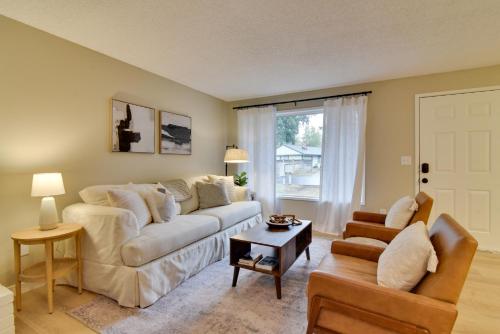 a living room with a couch and a chair at Lovely Vancouver Retreat with Home Gym! in Vancouver