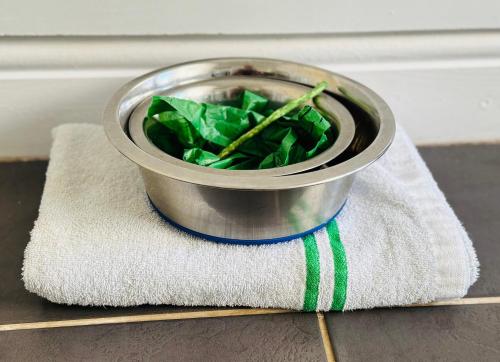 a metal bucket sitting on top of a towel at Beautiful, 1 Bedroom Cottage in Leicester