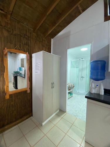 a kitchen with a white refrigerator in a room at Loft Tongoy 2 Interior sin vista al mar in Tongoy