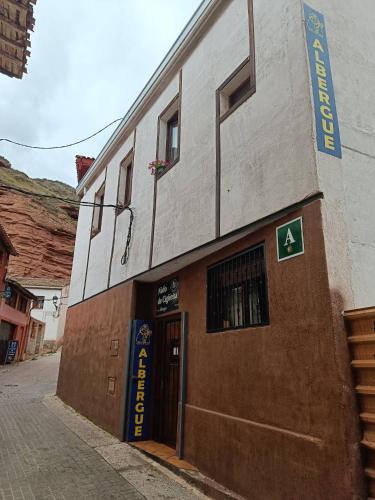 a building with a sign on the side of it at Albergue Nido de Cigüeña in Nájera