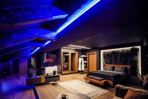 a bedroom with a bed and a blue ceiling at Unique Luxury Suite in Shkodër
