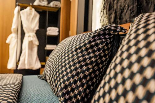a tie sitting on top of a couch at Unique Luxury Suite in Shkodër
