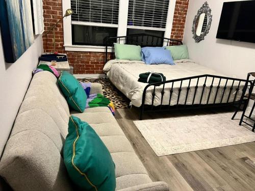 a living room with a couch and a bed at Studio Haven in Hollywood in Los Angeles