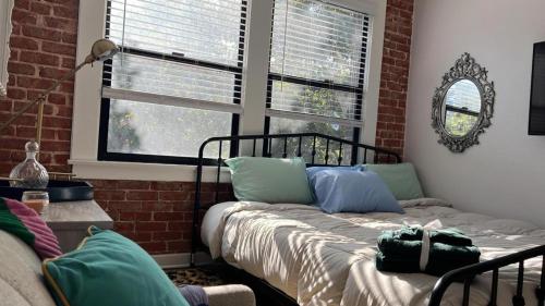 a living room with a bed and a window at Studio Haven in Hollywood in Los Angeles