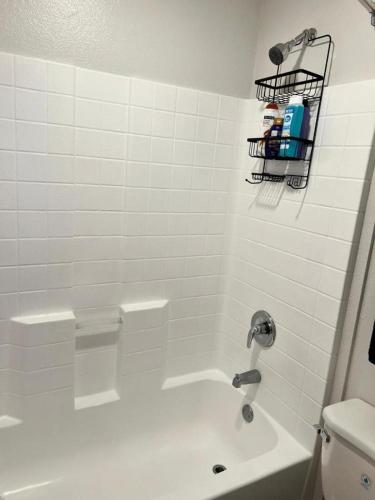 a white bathroom with a sink and a toilet at Studio Haven in Hollywood in Los Angeles