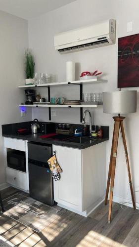 a kitchen with a sink and a stove at Studio Haven in Hollywood in Los Angeles