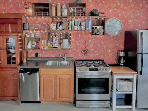 a kitchen with a stove and a sink at High Peaks Private Room #4 in a Shared House Homestay in Keene Valley
