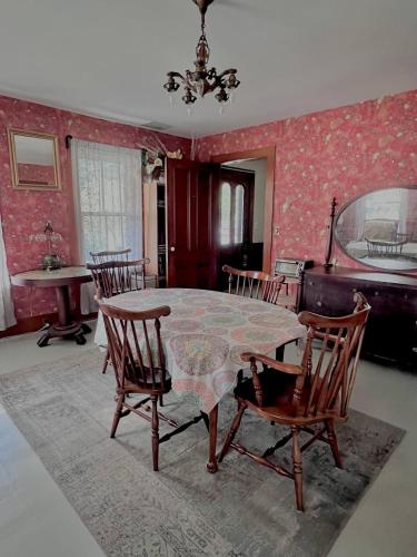 a dining room with a table and chairs at High Peaks Private Room #4 in a Shared House Homestay in Keene Valley