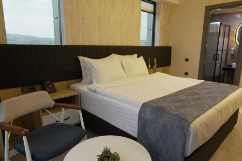 Ένα ή περισσότερα κρεβάτια σε δωμάτιο στο New City Otel