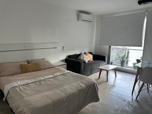 Ліжко або ліжка в номері Departamento Corrientes