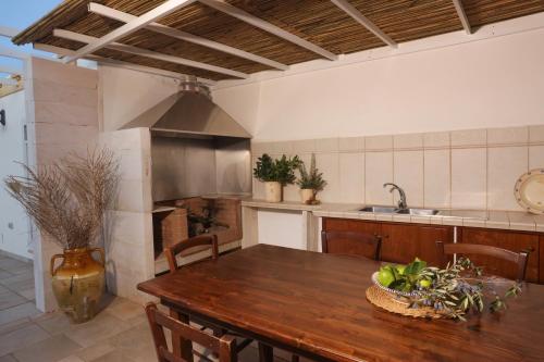 Kuchyň nebo kuchyňský kout v ubytování Trulli Arkama