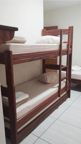 Ένα ή περισσότερα κρεβάτια σε δωμάτιο στο Hotel pousada estação dos devotos