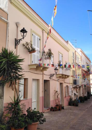 a row of buildings with plants in front of them at Casa Polixeni - Da e Nònne in Carloforte