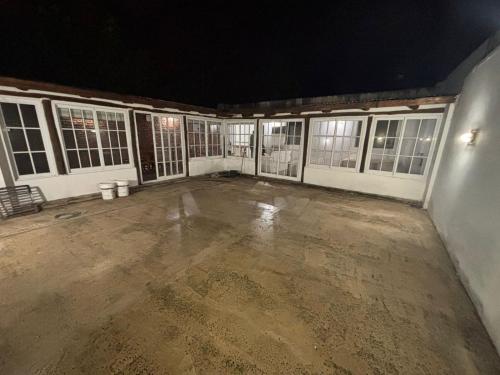 an empty garage with a lot of windows at night at Casa Céntrica con Quincho in Esquina