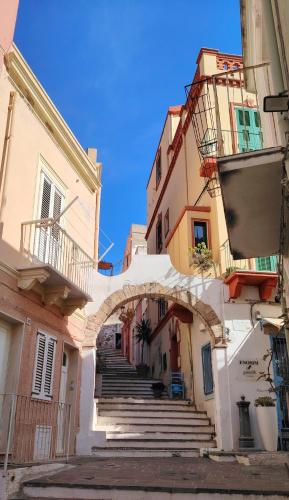 an alley in an old town with stairs at Casa Polixeni - Da e Nònne in Carloforte