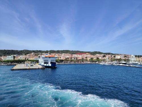 a boat is docked in a large body of water at Casa Fiorenza - Da e Nònne in Carloforte