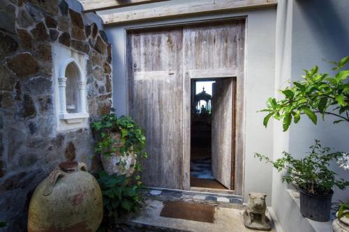 a wooden door with a window in a building at House of Rogues in Tortola Island